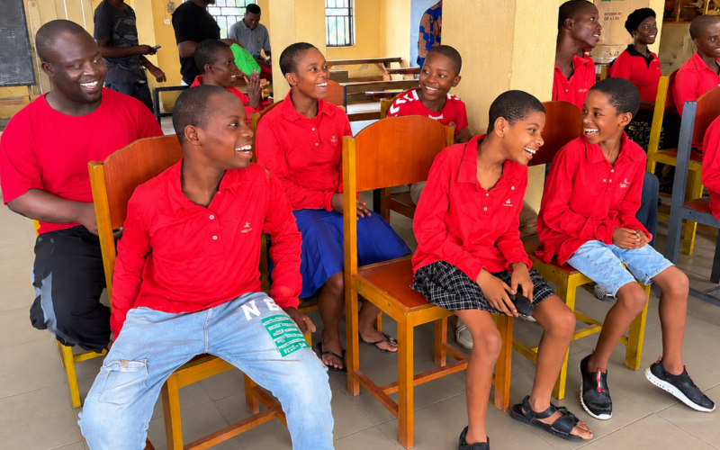 Smiling vulnerable children participating in a community program in Nigeria